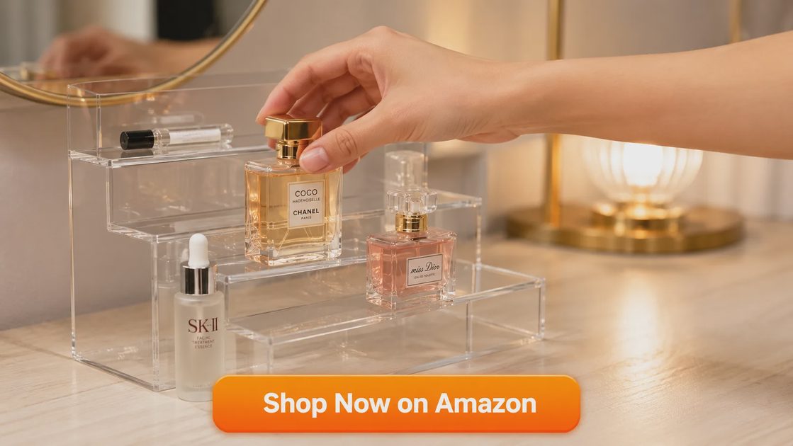 Close-up of four-tier acrylic display risers holding perfume and skincare